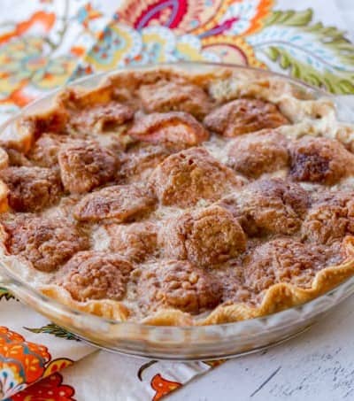 An apple pie with cinnamon sugar and heavy cream.