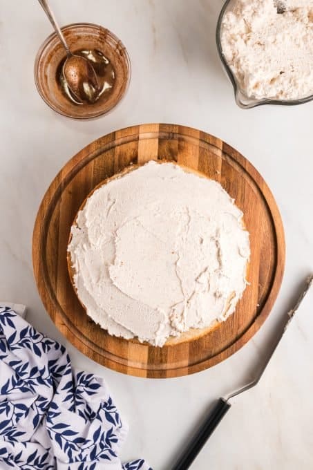 Frosting a Cinnamon Roll Layer Cake.