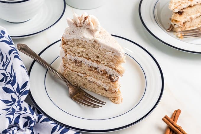 Layers of cake, cinnamon, and buttercream frosting in this Cinnamon Cake.