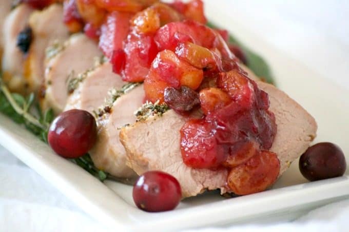 This Dijon Herb Roasted Pork with Cranberry Pear Chutney made with a Smithfield Prime Pork Tenderloin is an easy and delicious dinner perfectly suited for holiday entertaining!