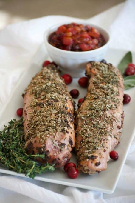 This Dijon Herb Roasted Pork with Cranberry Pear Chutney made with a Smithfield Prime Pork Tenderloin is an easy and delicious dinner perfectly suited for holiday entertaining!