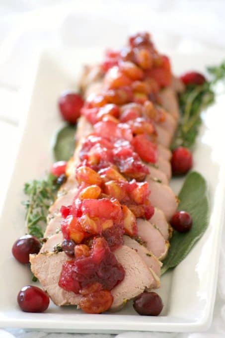 This Dijon Herb Roasted Pork with Cranberry Pear Chutney made with a Smithfield Prime Pork Tenderloin is an easy and delicious dinner perfectly suited for holiday entertaining!