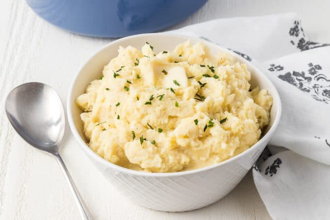 A bowl of mashed potatoes flavored with vanilla bean paste.