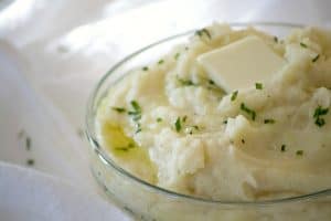 These Vanilla Mashed Potatoes are your classic mashed potatoes made even better with mascarpone and vanilla paste. The perfect complement to beef or turkey!