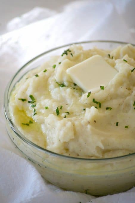 These Vanilla Mashed Potatoes are your classic mashed potatoes made even better with mascarpone and vanilla paste. The perfect complement to beef or turkey!
