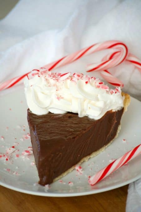 This Chocolate Peppermint Cream Pie is sure to be a big crowd pleaser during the holidays with its' smooth creamy chocolate filling and McCormick Pure Peppermint Extract. Santa might even choose this over cookies!