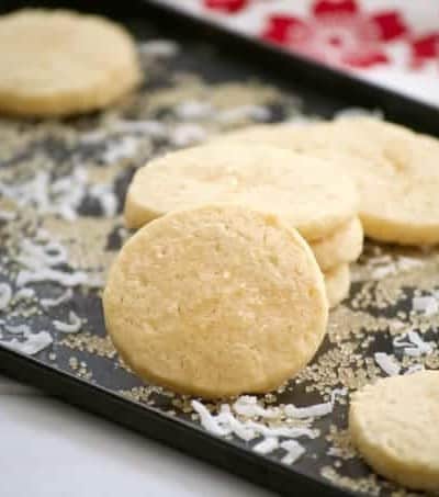 These Coconut Macadamia Sugar Cookies is a butter shortbread cookie with shredded coconut and macadamia nuts to remind you of the tropics.
