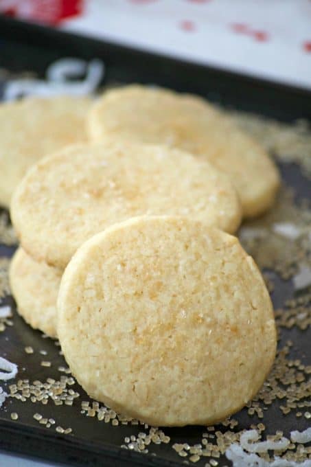 These Coconut Macadamia Sugar Cookies is a butter shortbread cookie with shredded coconut and macadamia nuts to remind you of the tropics.