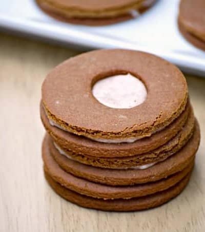 These Cream-Filled Molasses Cookies are a tasty gingerbread sandwich cookie with a cinnamon cream filling in the middle. They're great with a glass of milk!