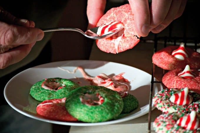 These Peppermint Blossom Cookies are a simple peppermint sugar cookie rolled in colored sugar and mulit-colored nonpareils with a Hershey's Peppermint Kiss.