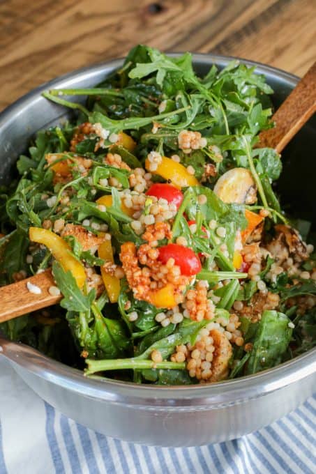 Tossing an Israeli Couscous Chicken Salad.