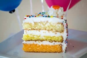 This ombre Citrus Layer Cake with vanilla, lemon and orange layers is colorfully decorated and adorned with helium-filled balloons - a fun birthday cake!