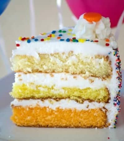 This ombre Citrus Layer Cake with vanilla, lemon and orange layers is colorfully decorated and adorned with helium-filled balloons - a fun birthday cake!