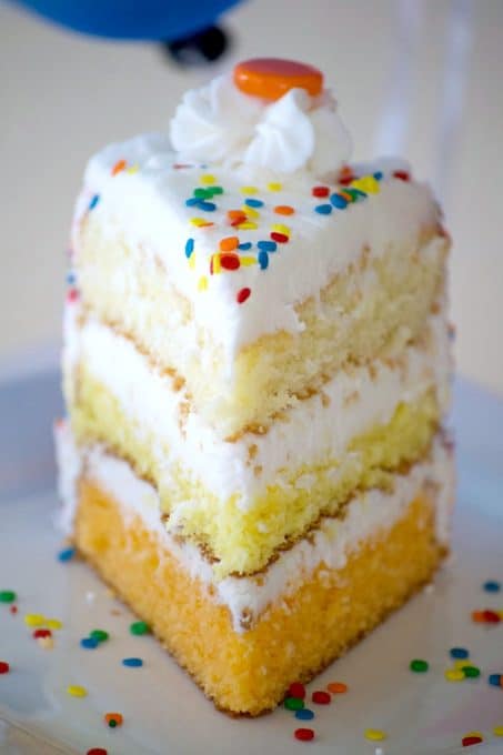 This ombre Citrus Layer Cake with vanilla, lemon and orange layers is colorfully decorated and adorned with helium-filled balloons - a fun birthday cake!