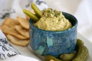 Dill Pickle Hummus is the perfect way to satisfy your craving. Chickpeas, dill pickles, and tahini make this a healthy snack you'll have trouble sharing. 