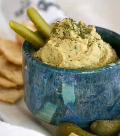 Dill Pickle Hummus is the perfect way to satisfy your craving. Chickpeas, dill pickles, and tahini make this a healthy snack you'll have trouble sharing. 