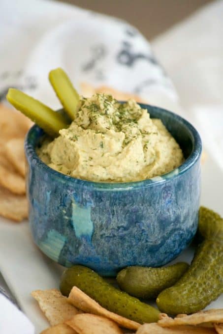 Dill Pickle Hummus is the perfect way to satisfy your craving. Chickpeas, dill pickles, and tahini make this a healthy snack you'll have trouble sharing. 