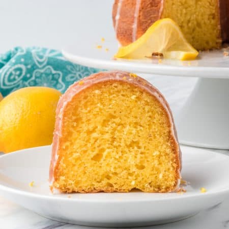 A piece of Easy Lemon Cake with lemons