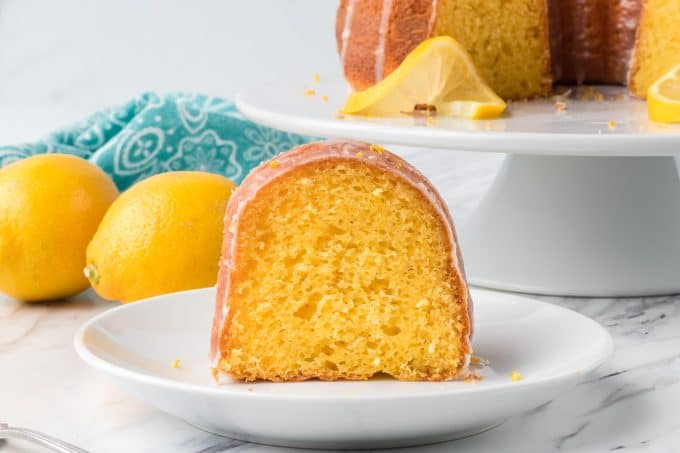 A piece of Easy Lemon Cake with lemons