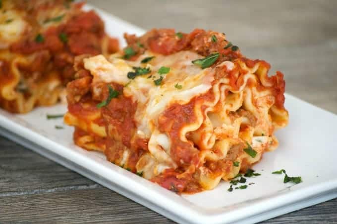 Cheese filled lasagna rolls topped with a flavorful meat sauce - a meal you can't help but share. Share them for your Glad to Give meal to see the smiles.