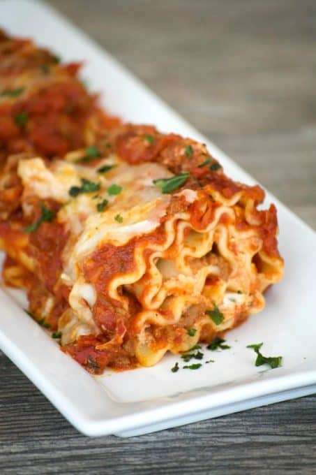 Cheese filled lasagna rolls topped with a flavorful meat sauce - a meal you can't help but share. Share them for your Glad to Give meal to see the smiles.