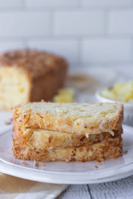 Slices of pineapple bread topped with toasted coconut.