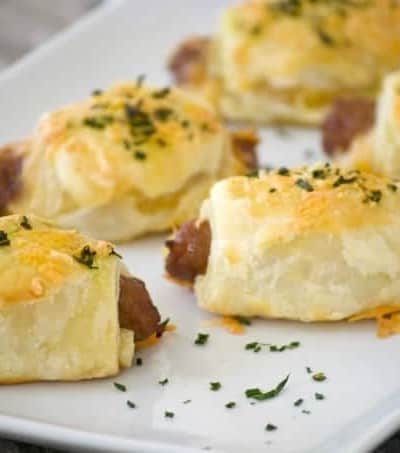 These Cheesy Puff Pastry Sausage Rolls are light and airy with delicious bites of cheese and sausage. They're an appetizing addition for any Easter brunch. 