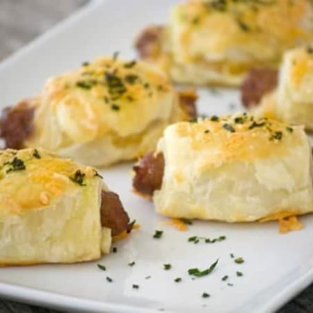 These Cheesy Puff Pastry Sausage Rolls are light and airy with delicious bites of cheese and sausage. They're an appetizing addition for any Easter brunch. 