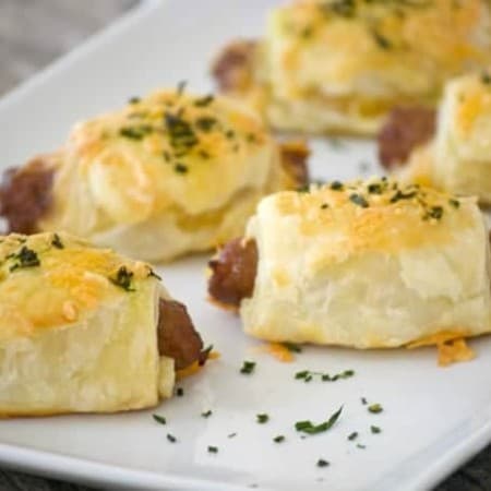 These Cheesy Puff Pastry Sausage Rolls are light and airy with delicious bites of cheese and sausage. They're an appetizing addition for any Easter brunch.