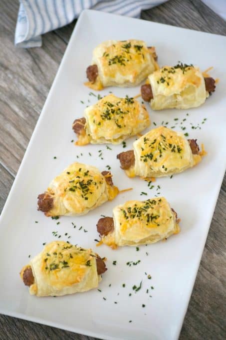 These Cheesy Puff Pastry Sausage Rolls are light and airy with delicious bites of cheese and sausage. They're an appetizing addition for any Easter brunch. 