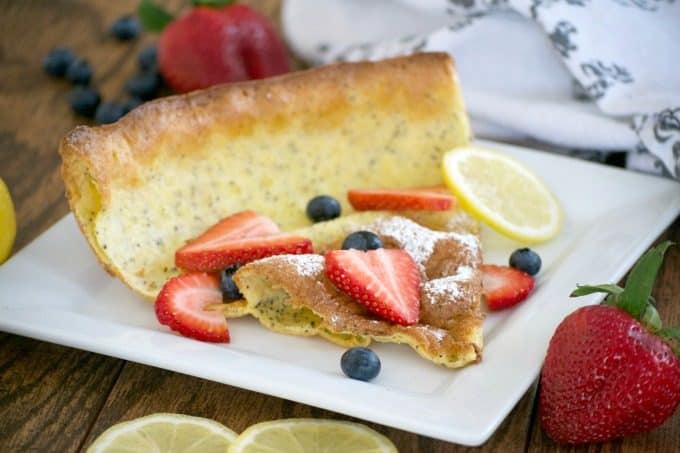 This Lemon Poppy Seed Dutch Baby is a light and fluffy pancake baked in the oven. With a light lemon flavor, it's a perfect breakfast treat for the weekend.