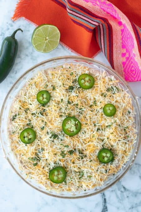 Taco dip loaded with cheese and jalapeños.