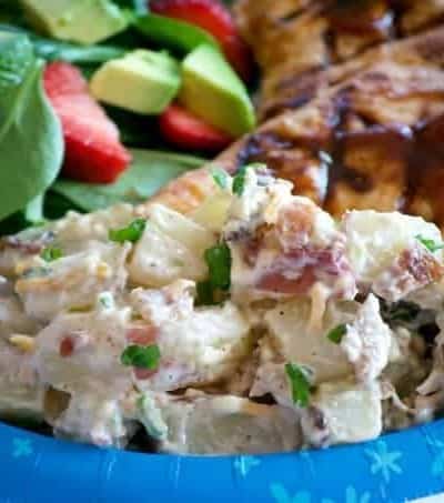 Our Loaded Red Bliss Potato Salad with all the fixin's - a dijon-mayo dressing, bacon, green onions and cheese is a potato salad you'll eat all summer long!