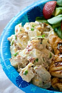 Our Loaded Red Bliss Potato Salad with all the fixin's - a dijon-mayo dressing, bacon, green onions and cheese is a potato salad you'll eat all summer long!