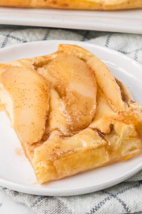 Pear slices top a sweet cream Danish