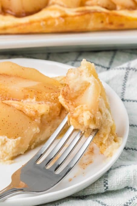 A puff pastry Danish made with pears and a marzipan cream cheese filling.