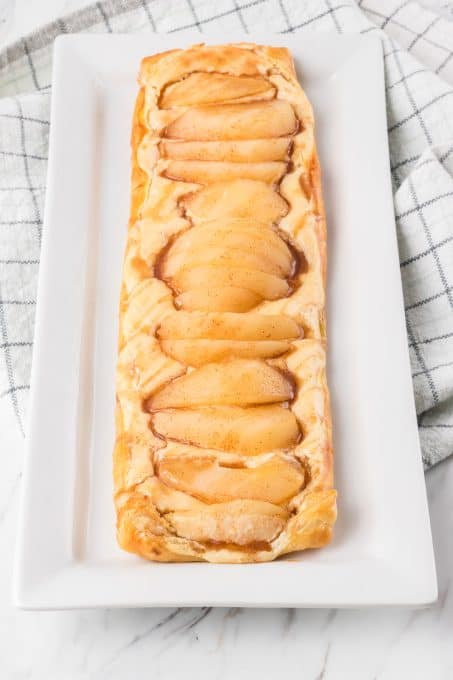 Pears on top of a sweet cream filling in puff pastry.