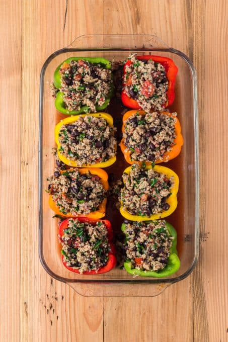 A baking dish filled with quinoa stuffed peppers