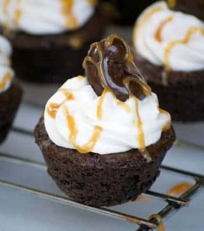 Salted Caramel Cashew Brownie Bites with a Marich Salted Caramel inside, topped with vanilla buttercream and a Marich Cashew are a great bite-sized treat!