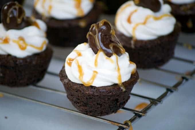 Salted Caramel Cashew Brownie Bites with a Marich Salted Caramel inside, topped with vanilla buttercream and a Marich Cashew are a great bite-sized treat!