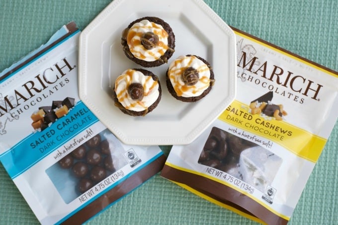 Salted Caramel Cashew Brownie Bites with a Marich Salted Caramel inside, topped with vanilla buttercream and a Marich Cashew are a great bite-sized treat!