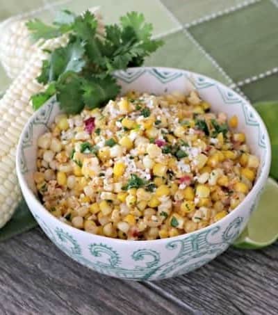 Corn, cilantro, cayenne, lime, Cotija cheese and more make this Skillet Mexican Street Corn from Mary Younkin's (Barefeet in the Kitchen) The Weeknight Dinner Cookbook an irresistible side dish.