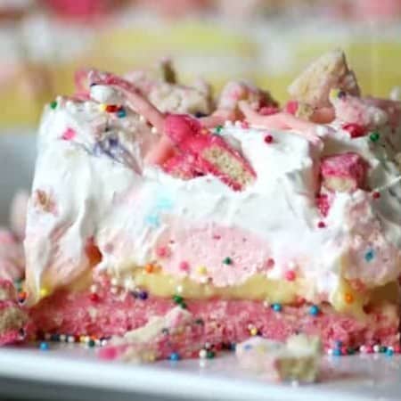 Circus Animal Cookie Dream Bars with a cookie crust and sweet, colorful layers are a fun, No Bake dessert that's sure to bring out the kid in anyone!