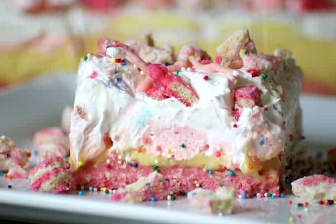 Circus Animal Cookie Dream Bars with a cookie crust and sweet, colorful layers are a fun, No Bake dessert that's sure to bring out the kid in anyone!