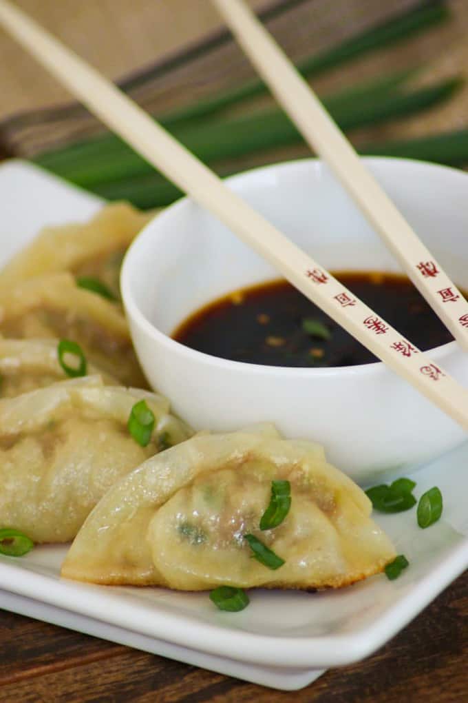 These easy Pork Potstickers with ground pork, ginger, garlic, cabbage and soy sauce wrapped in a light dough are perfect as an appetizer or main course!