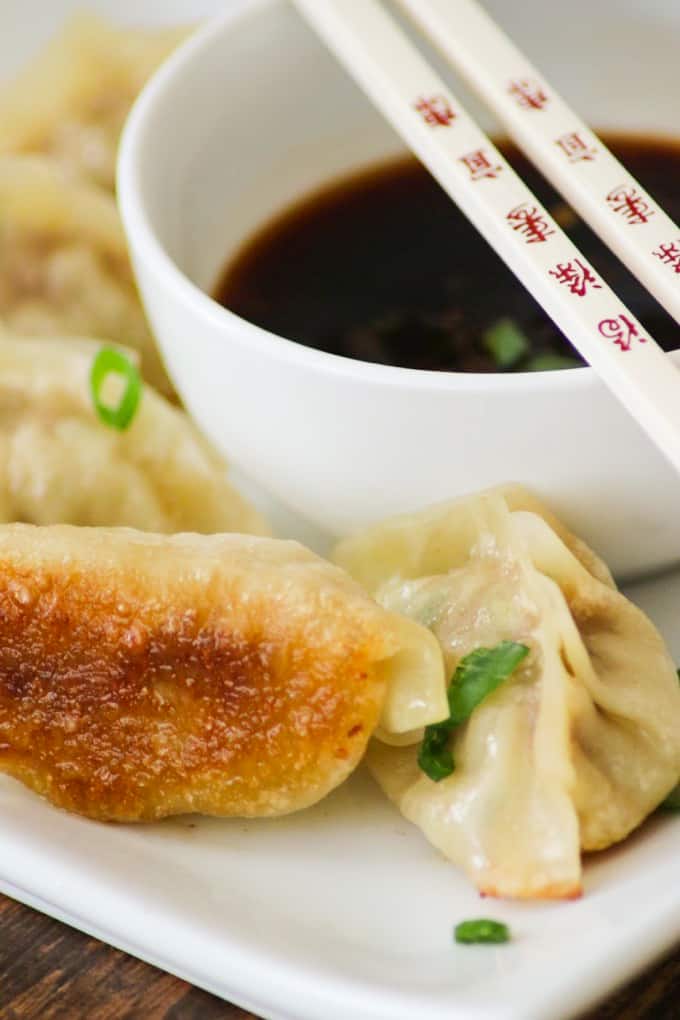 These easy Pork Potstickers with ground pork, ginger, garlic, cabbage and soy sauce wrapped in a light dough are perfect as an appetizer or main course!