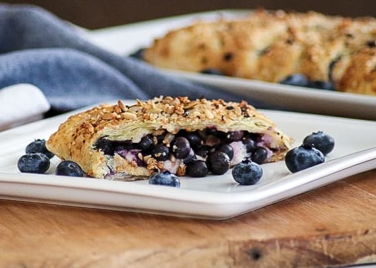 This Blueberry Ginger Cheese Danish is quickly going to become your new favorite breakfast treat! A slice of Puff Pastry with sweetened cream and blueberry ginger filling sprinkled with McCormick® Good Morning Blueberry Ginger Breakfast Toppers is hard to resist.