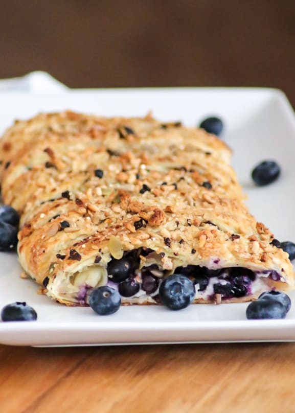 This Blueberry Ginger Cheese Danish is quickly going to become your new favorite breakfast treat! A slice of Puff Pastry with sweetened cream and blueberry ginger filling sprinkled with McCormick® Good Morning Blueberry Ginger Breakfast Toppers is hard to resist.