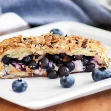 This Blueberry Ginger Cheese Danish is quickly going to become your new favorite breakfast treat! A slice of Puff Pastry with sweetened cream and blueberry ginger filling sprinkled with McCormick® Good Morning Blueberry Ginger Breakfast Toppers is hard to resist.