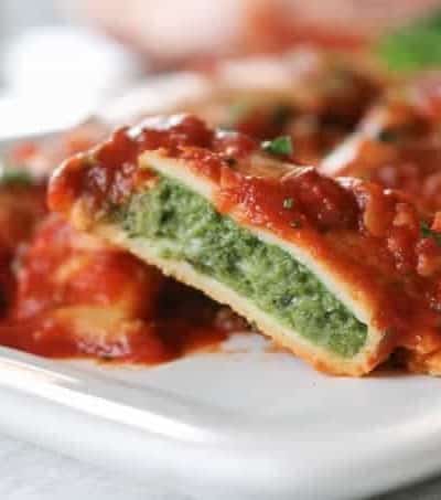 This easy Spinach and Cheese Manicotti is an old family favorite. It starts with a smooth, creamy filling made of cottage cheese, spinach, and eggs, and is rolled into a homemade crepe. Serve them with a salad and you have a delicious dinner that your family will enjoy for years to come.